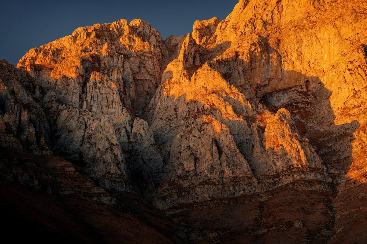 Golden light on the rock face of Khustup