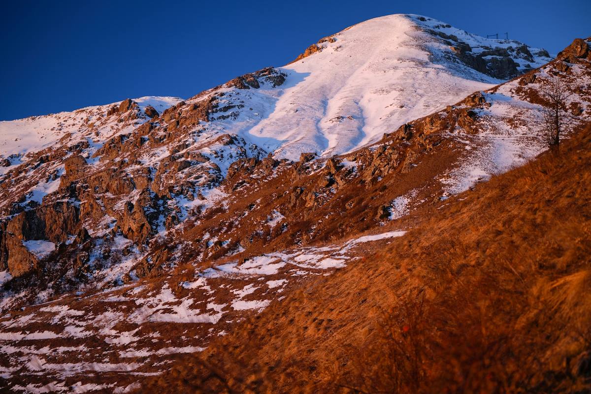 Alpenglow over autumn slopes
