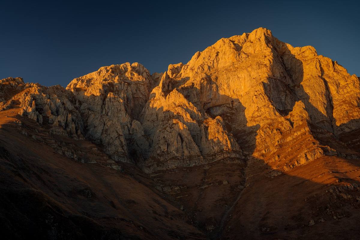 The amber rock face at last light
